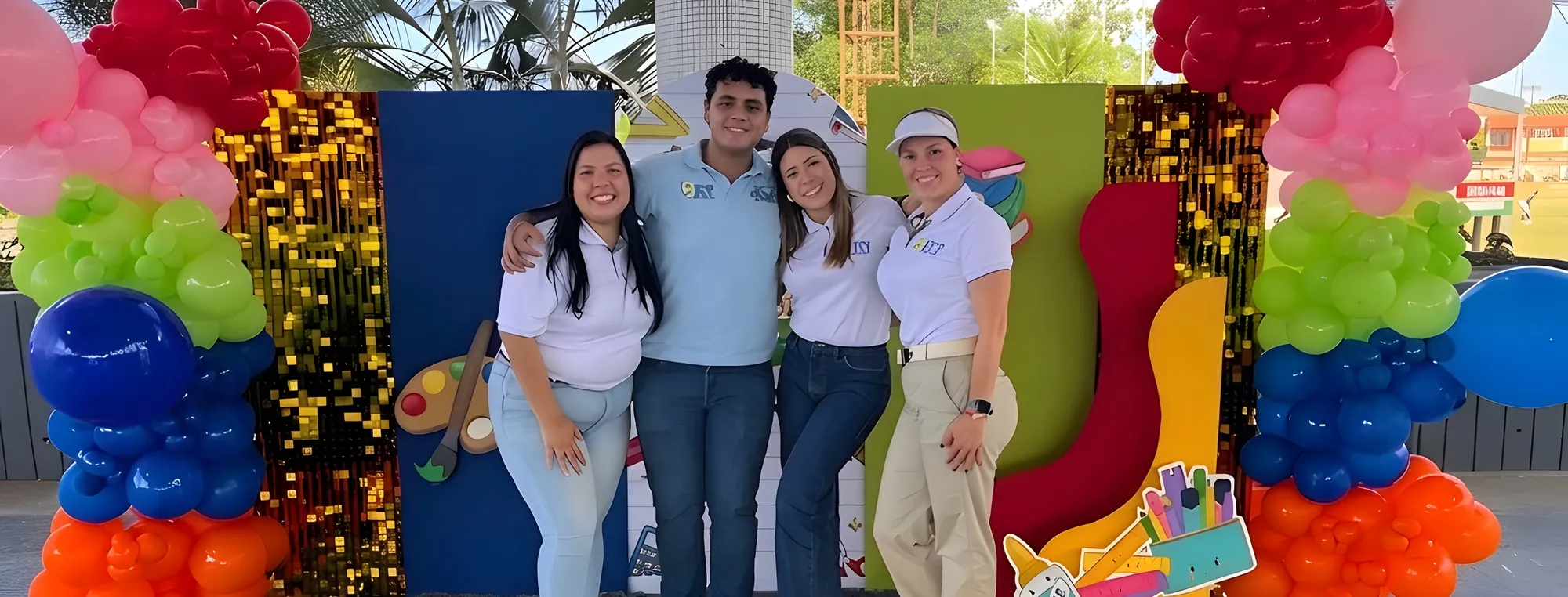 Part of the BELT team, in uniform polo shirts, at an event run by the company.